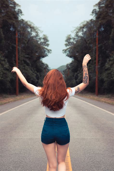 Woman in Yellow Crop Top Raising Her Hands · Free Stock .